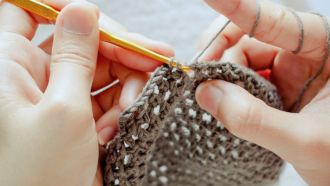 hands crocheting