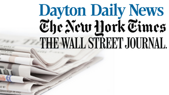 folded copies of the Dayton Daily News, The New York Times, and The Wall Street Journal