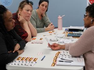 a group of adults participate in a discussion