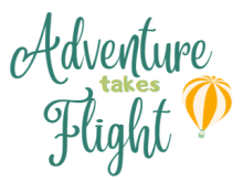 the words Adventure Takes Flight written in scripty text
